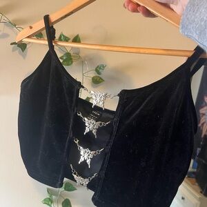 Black Crop Top with butterfly’s covering the front.